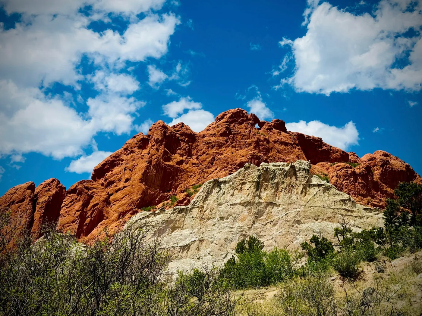 Red rock formations and white rock under a blue sky at Garden of the Gods in Colorado Springs
